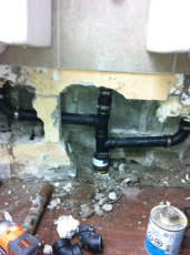 Urinal for commercial washroom drain pipe repair
