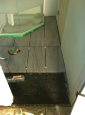 Bathroom install tile floor closeup